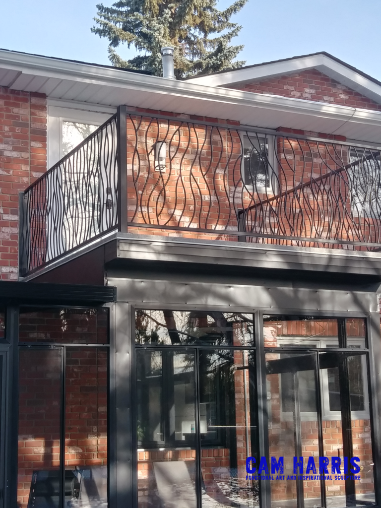 iron deck railing Bent Design created by Cam Harris for a client in Calgary Alberta